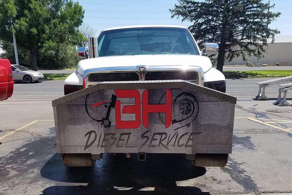 About BH Diesel Service signage with truck